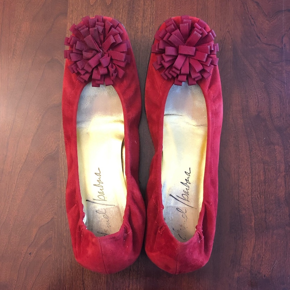 Red suede ballet flats with Pom Pom detail